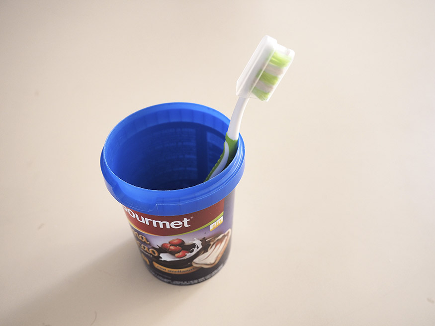 toothbrush and small bucket